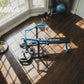 adjustable bench press machine for home gym with guided press arms and weight plate system